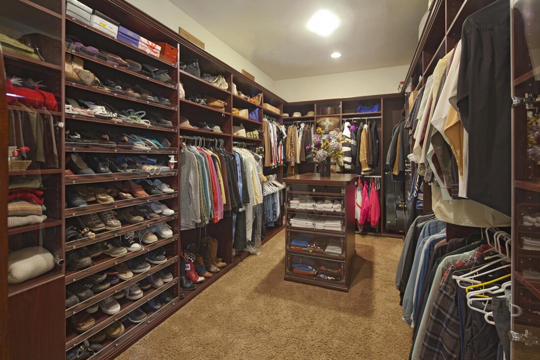 walk in closet with garments